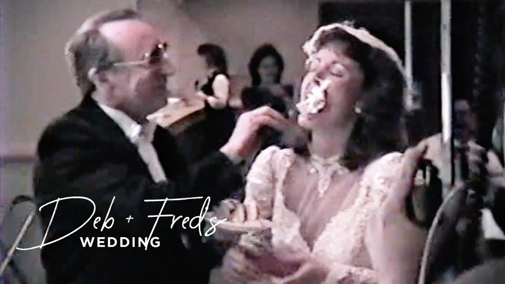 bride and groom eating cake at their wedding on vhs